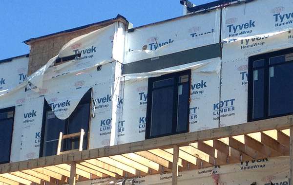 Tyvek home wrap left exposed to wind and UV rays